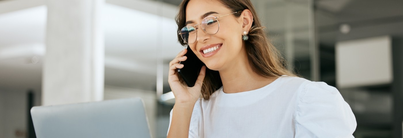 Woman with glasses talking on phone