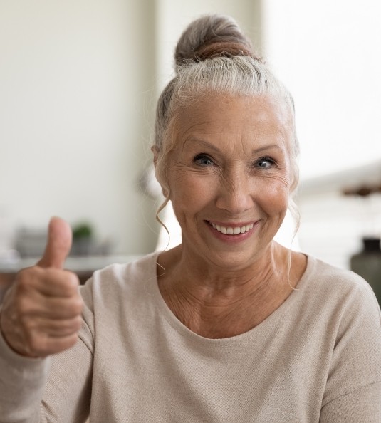 Senior woman giving a thumbs up