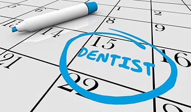 Calendar with circled reminder to visit Carrollton dentist 