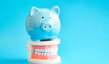 A piggy bank that cuts the cost of tooth extraction in Carrolton 