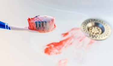 A toothbrush with blood on it