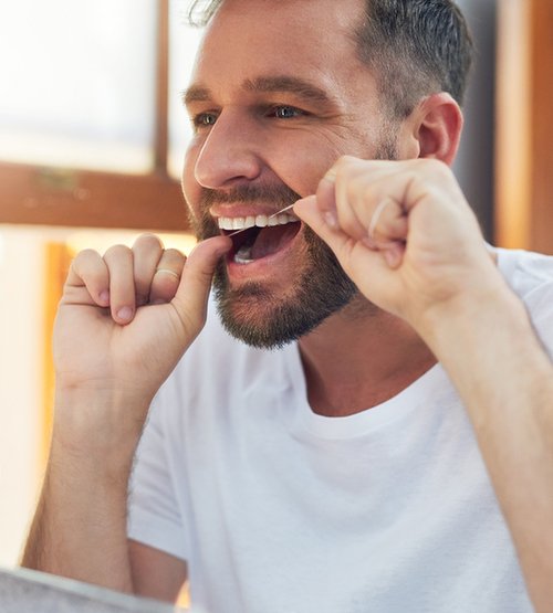 The benefits of gum recontouring include a reduced risk of gum disease and infections