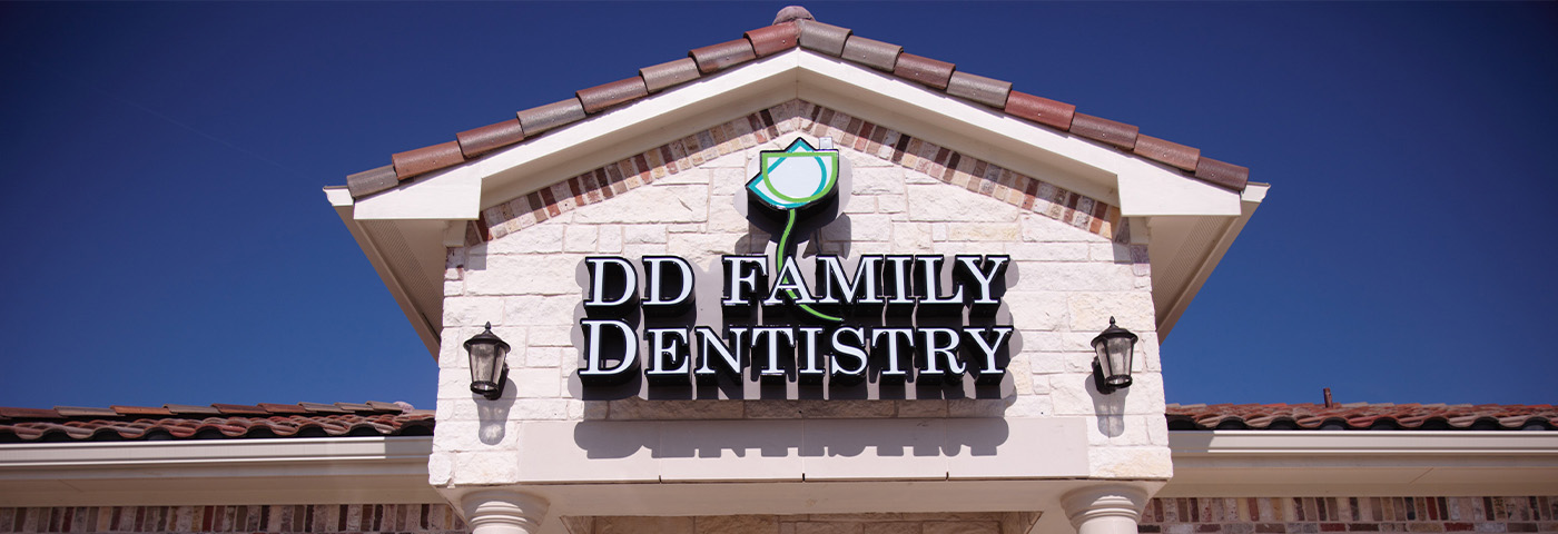 DD Family Dentistry of Carrollton logo on top of building