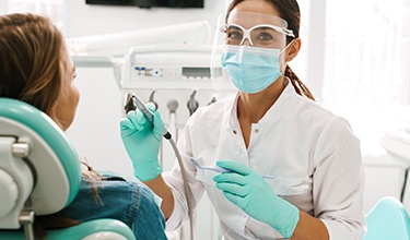 a cosmetic dentist treating a patient