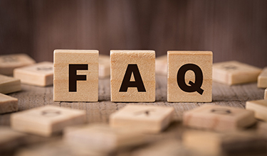 wooden blocks that spell out FAQ