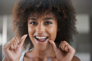 woman flossing happy 