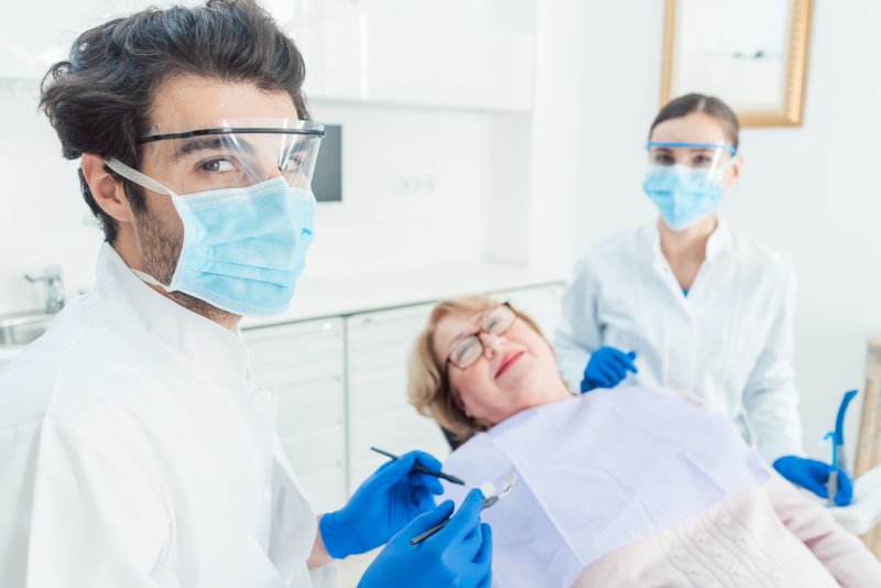 Family dentist in Carrollton wearing PPE