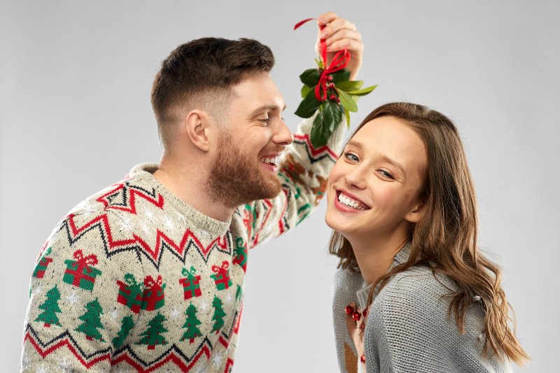 couple underneath the mistletoe