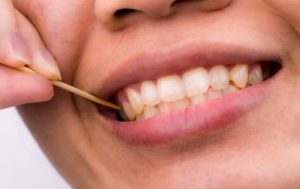 a person using a toothpick