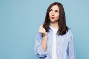 Woman wondering if she can get Invisalign with her crown 